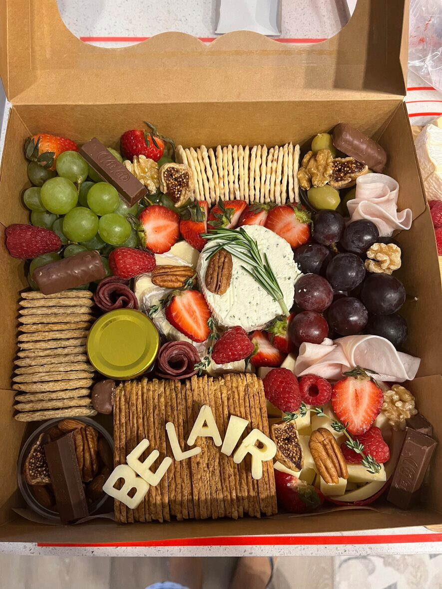 Large grazing box with cheese letters, brie, charcuterie, grapes and honey