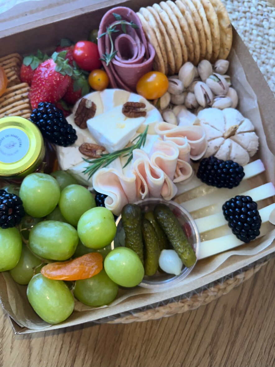 Medium grazing box with folded halal charcuterie, brie, grapes, pistachios and cornichons