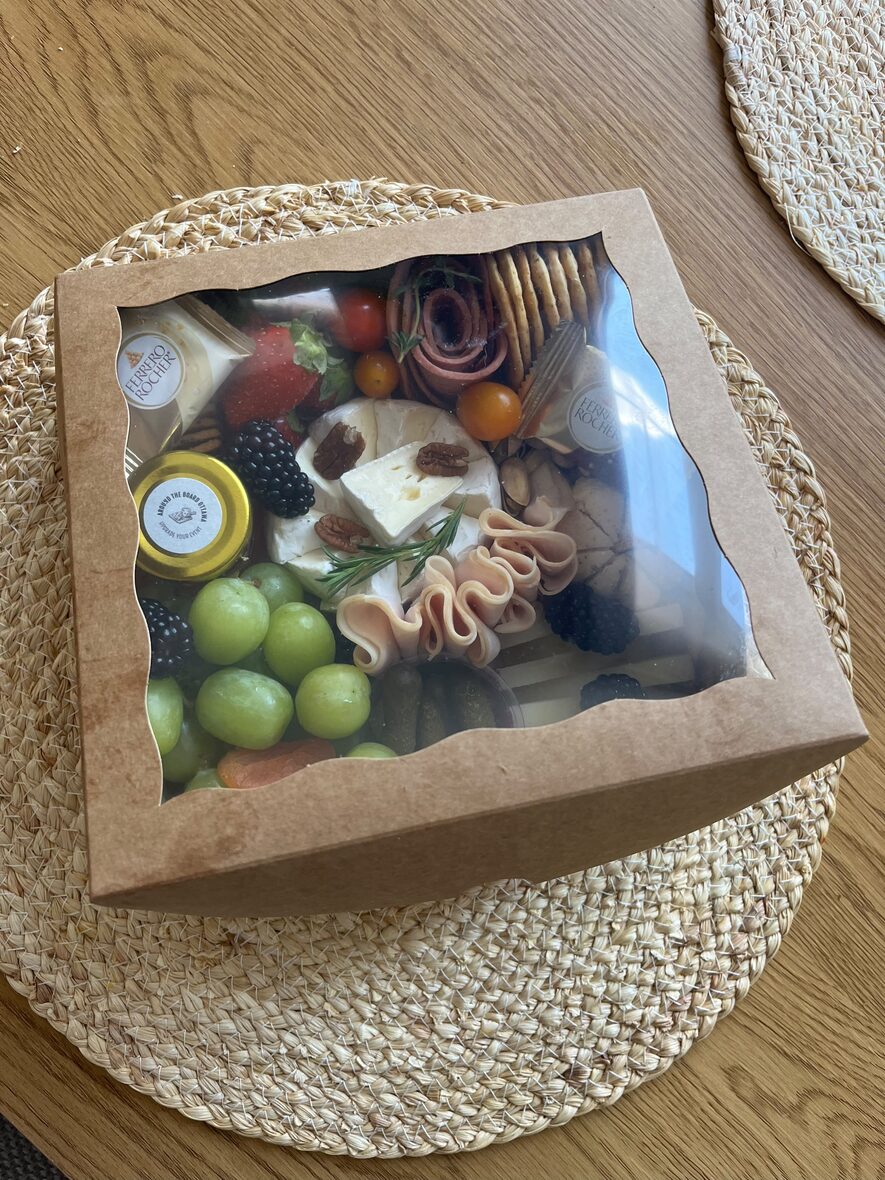 Medium grazing box top view with cheese, halal cured meats, fruit and nuts